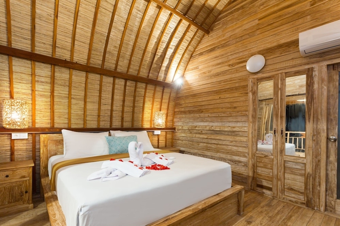 Imagen de la habitación del Hotel The Dewi Premier. Foto 15