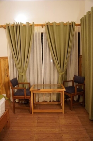 Imagen de la habitación del Hotel The Dharmas Resort. Foto 8