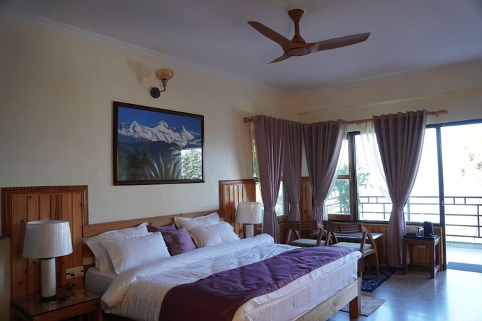 Imagen de la habitación del Hotel The Dharmas Resort. Foto 19