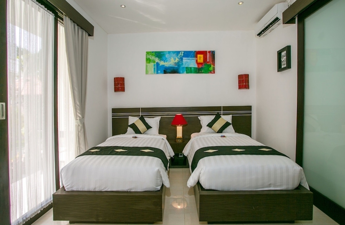 Imagen de la habitación del Hotel The Diana Suite Tuban. Foto 2