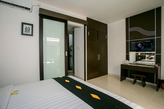 Imagen de la habitación del Hotel The Diana Suite Tuban. Foto 3