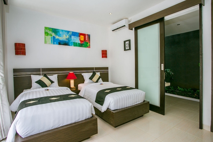Imagen de la habitación del Hotel The Diana Suite Tuban. Foto 13