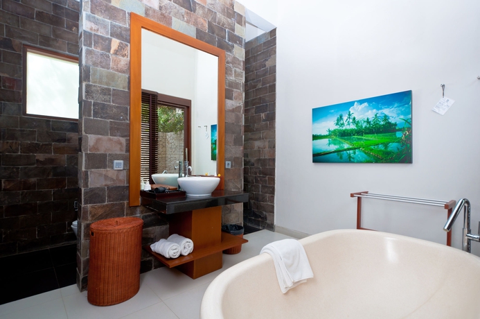 Imagen de la habitación del Hotel The Dipan Resort Petitenget. Foto 9