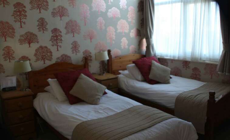 Imagen de la habitación del Hotel The Dog and Partridge Country Inn. Foto 15