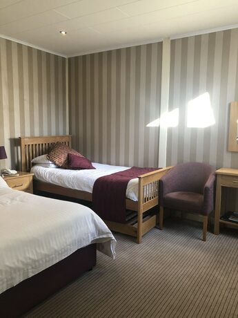 Imagen de la habitación del Hotel The Dog and Partridge Country Inn. Foto 18