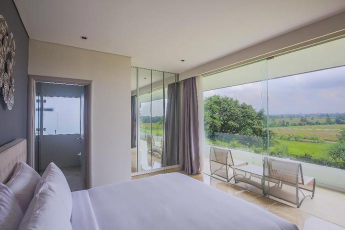 Imagen de la habitación del Hotel The Double View Mansions Bali. Foto 10