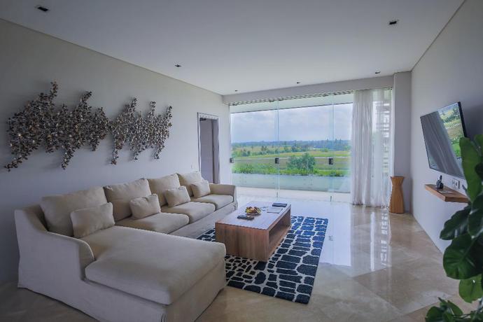 Imagen de la habitación del Hotel The Double View Mansions Bali. Foto 11