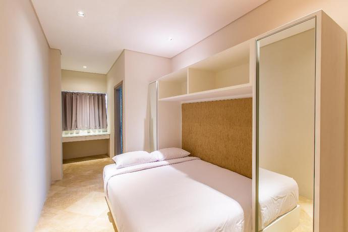 Imagen de la habitación del Hotel The Double View Mansions Bali. Foto 12