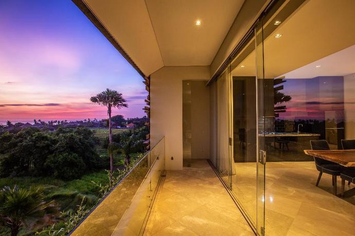 Imagen de la habitación del Hotel The Double View Mansions Bali. Foto 16