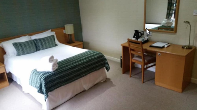 Imagen de la habitación del Hotel The Dunavon. Foto 11