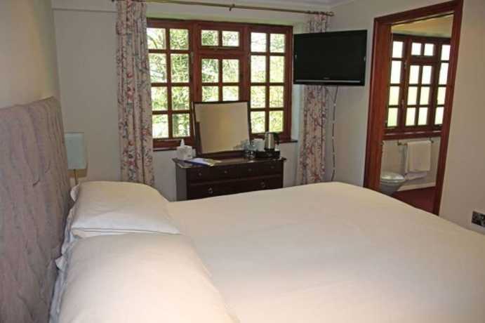 Imagen de la habitación del Hotel The Eagle House. Foto 8