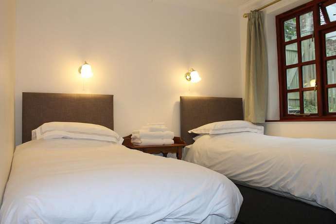 Imagen de la habitación del Hotel The Eagle House. Foto 9