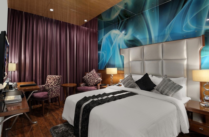 Imagen de la habitación del Hotel The Elanza. Foto 8