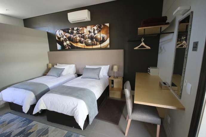 Imagen de la habitación del Hotel The Elegant Guesthouse. Foto 12