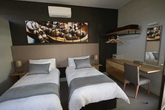 Imagen de la habitación del Hotel The Elegant Guesthouse. Foto 15