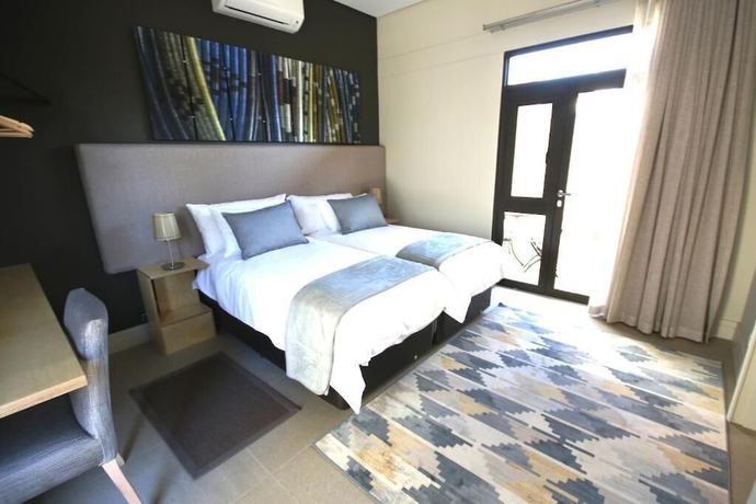 Imagen de la habitación del Hotel The Elegant Guesthouse. Foto 16