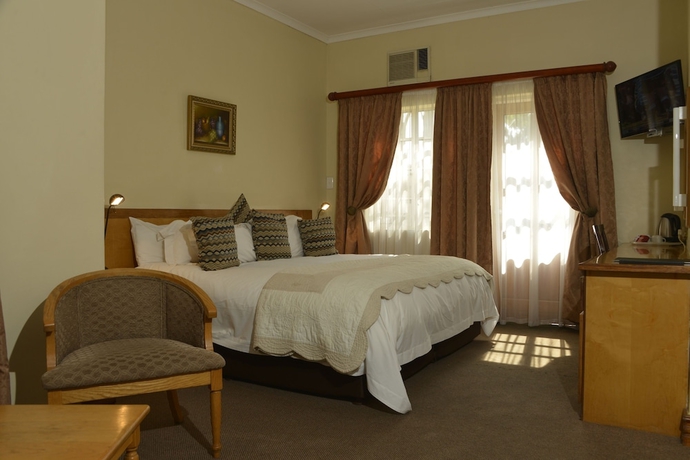 Imagen de la habitación del Hotel The Elegant Lodge. Foto 6