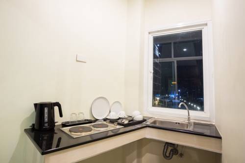 Imagen de la habitación del Hotel The Elegant Patong. Foto 16