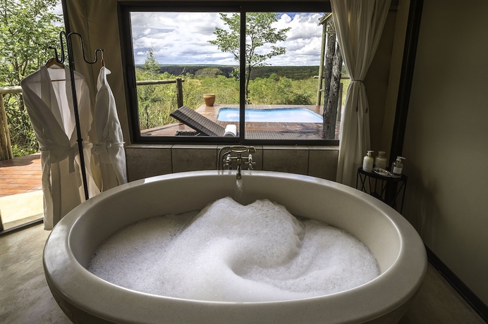 Imagen de la habitación del Hotel The Elephant Camp. Foto 13