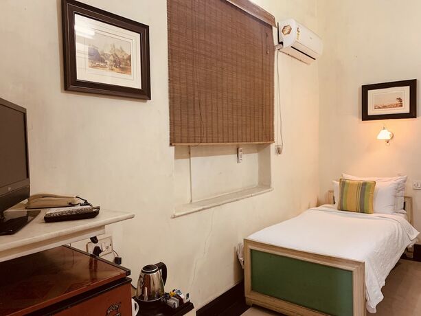Imagen de la habitación del Hotel The Elgin Fairlawn Kolkata. Foto 17