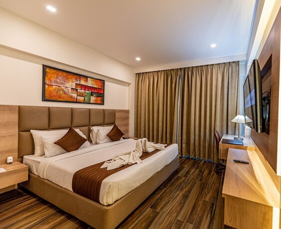 Imagen de la habitación del Hotel The Elite Lucknow. Foto 11