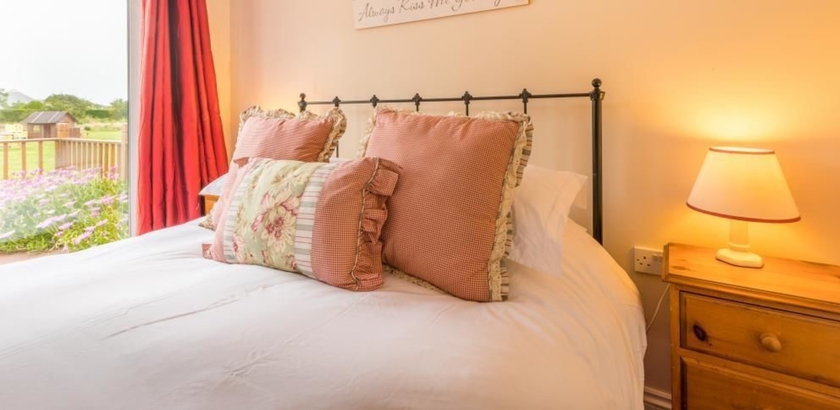 Imagen de la habitación del Hotel The Ellingham Cottages. Foto 8