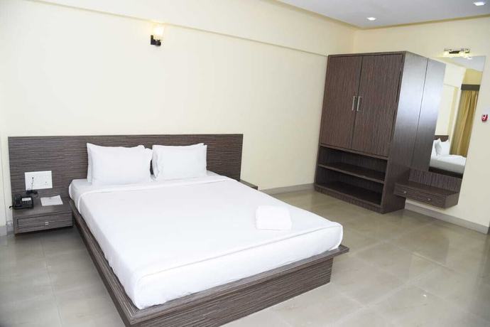 Imagen de la habitación del Hotel The Emerald Resort, Pune. Foto 5