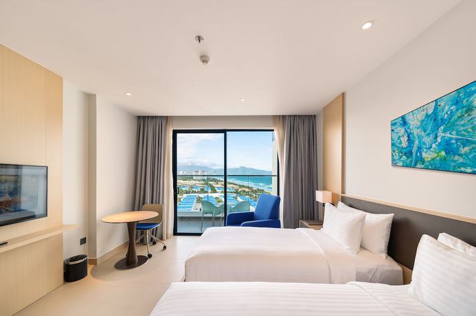 Imagen de la habitación del Hotel The Empyrean Cam Ranh Beach Resort. Foto 16