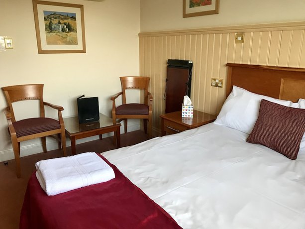 Imagen de la habitación del Hotel The Evenhill. Foto 8