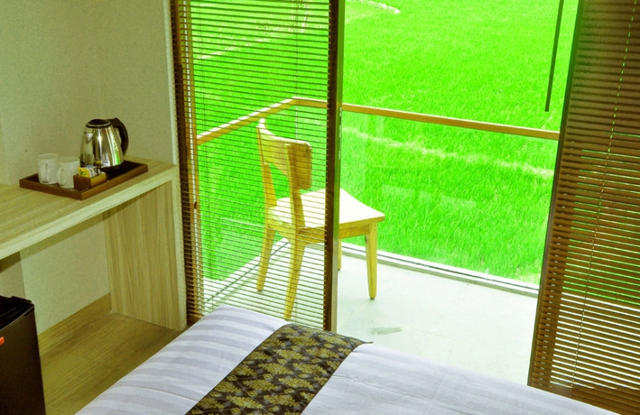 Imagen de la habitación del Hotel The Evitel Resort Ubud. Foto 10