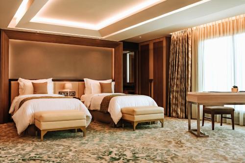 Imagen de la habitación del Hotel The Excelton Hotel. Foto 7