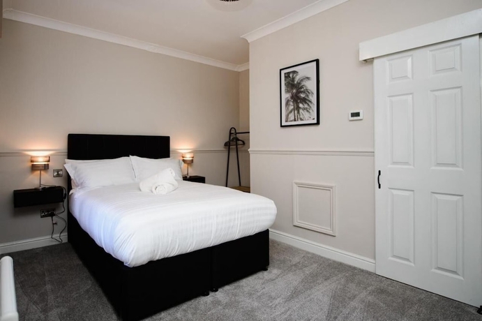 Imagen de la habitación del Hotel The Exchange Coach House Inn. Foto 11