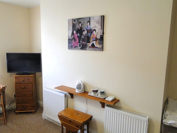 Imagen de la habitación del Hotel The Exchange Coach House Inn. Foto 16