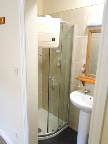 Imagen de la habitación del Hotel The Exchange Coach House Inn. Foto 18