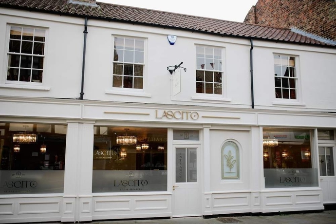 Imagen del bar/restaurante del Hotel The Exchange Coach House Inn. Foto 3