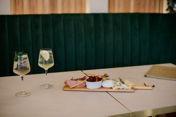 Imagen del bar/restaurante del Hotel The Exchange Coach House Inn. Foto 5