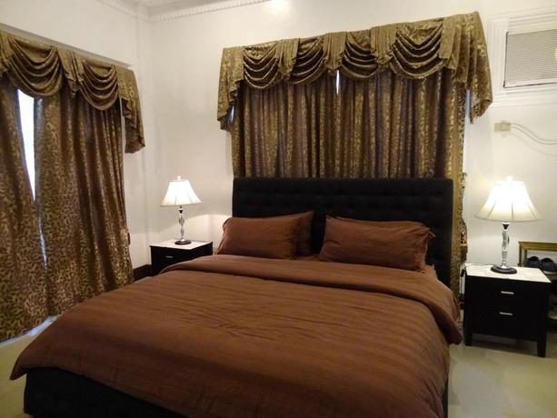 Imagen general del Hotel The Executive Villa Inn and Suites. Foto 3