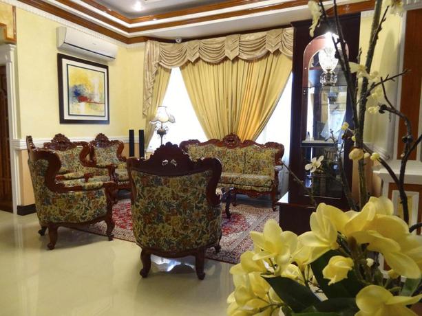 Imagen de los interiores del Hotel The Executive Villa Inn and Suites. Foto 6