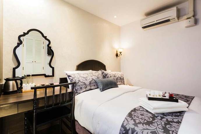 Imagen de la habitación del Hotel The Fah Silom. Foto 11