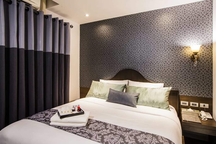 Imagen de la habitación del Hotel The Fah Silom. Foto 12