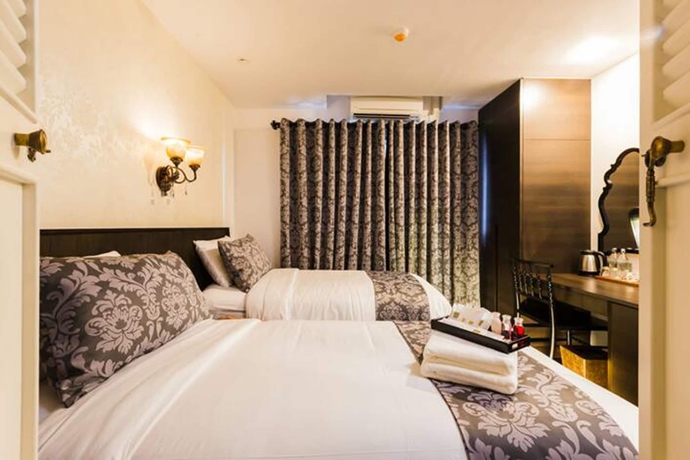 Imagen de la habitación del Hotel The Fah Silom. Foto 14