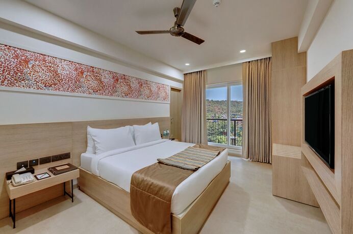 Imagen de la habitación del Hotel The Fern Habitat Candolim Goa. Foto 24