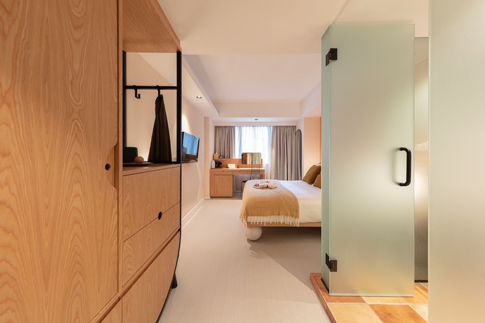 Imagen de la habitación del Hotel The Figo. Foto 5