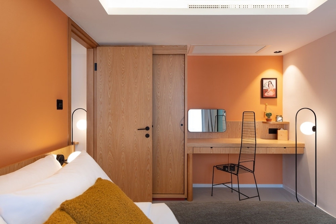 Imagen de la habitación del Hotel The Figo. Foto 7