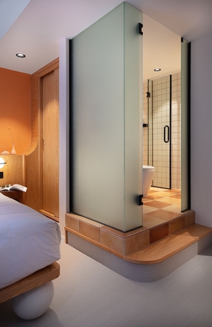 Imagen de la habitación del Hotel The Figo. Foto 9