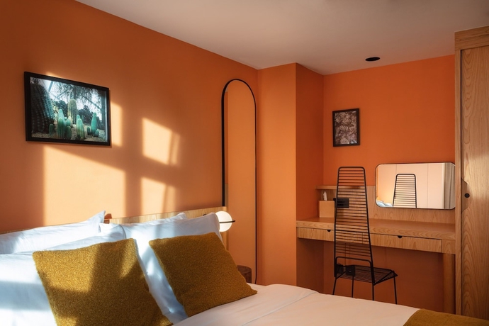 Imagen de la habitación del Hotel The Figo. Foto 10