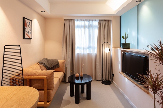 Imagen de la habitación del Hotel The Figo. Foto 16