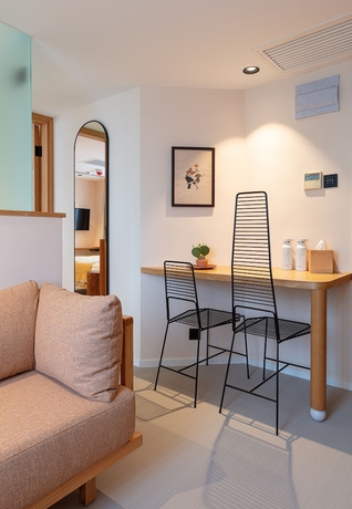 Imagen de la habitación del Hotel The Figo. Foto 17