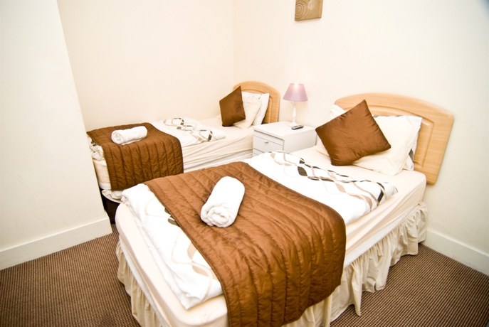 Imagen de la habitación del Hotel The Firs Lodge. Foto 10