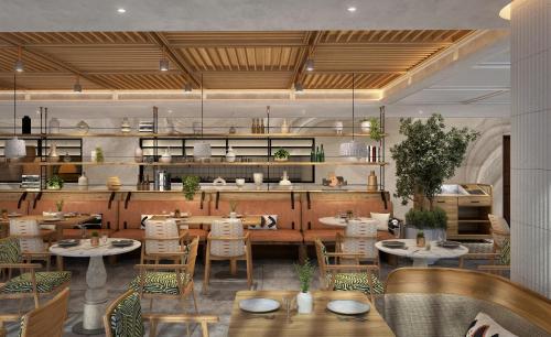 Imagen del bar/restaurante del Hotel The First Collection Business Bay. Foto 2